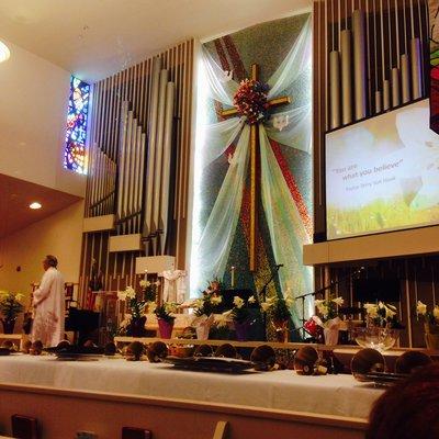 Easter Celebration at Lancaster United Methodist Church with Handbell Choir tables in front.