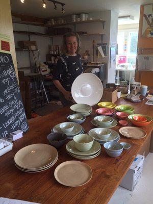 Artist/owner Mary Anne Davis with the latest kiln crop.