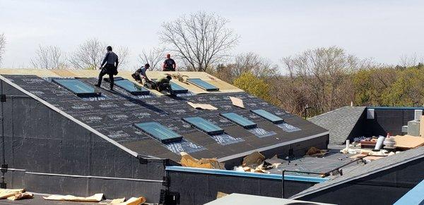 Chain of child daycare schools with leaky old Atrium roofs repaired with shingles and skylights