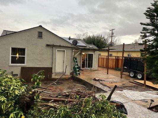 Demo day, outdoor door converted to indoor door, window to be sealed off.  Had to match elevation of existing house.