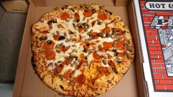 Large pepperoni, sausage, and mushroom pizza