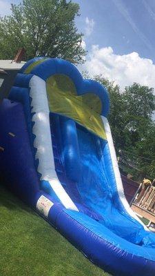 A wet or dry slide with a pool or ball pit at the bottom