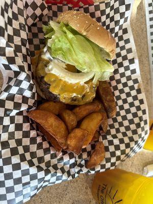 Cheeseburger and wedges.  Wry tasty and large meal.