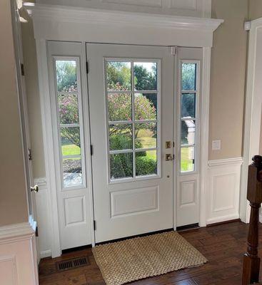 Energy efficient doors featuring fiberglass entry door and sidelines with cottage style grids.
 Exterior: Coal Black
 Interior: Snow White