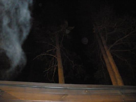 Spa from the inside, night view of the sky with steam rising upward