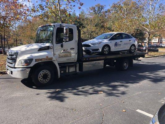 Flatbed towing in Alexandria Virginia. We're doing an emergency tow for a customer with a disabled vehicle in Alexandria Virginia.