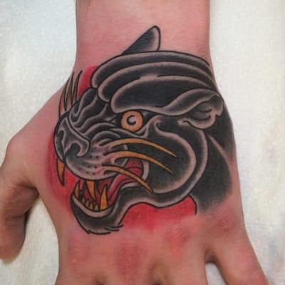 Panther hand tattoo by Dirk Spece