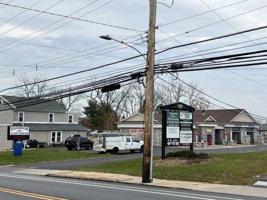 Exterior from Main Street. Enter where there's a car wash. Offices are in the rear.