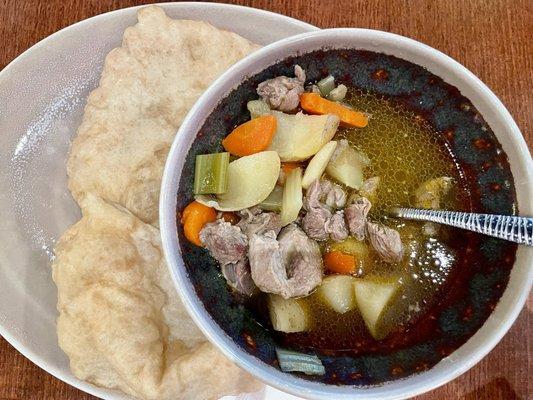 Lamb meat stew with veggies & Frybread. Large bowl with delicious broth full of flavor. Large frybread. Very filling & satisfying.