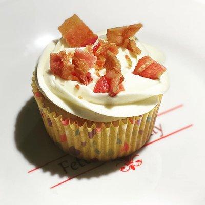 Gluten free vanilla cupcake with maple buttercream frosting topped with bacon. YUMMY!