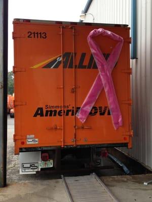 An AmeriMOVE truck dressed up for Breast Cancer Awareness.