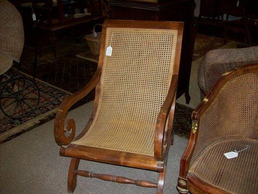 Caned, curved back chair