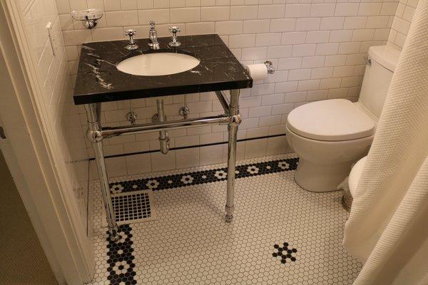 Custom hex tile inlay with wainscot and Restoration Hardware vanity