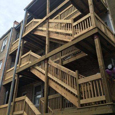 Big three story back porch . Threaded lumber.