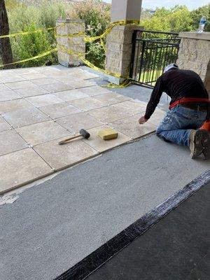 Setting tile on second porch house