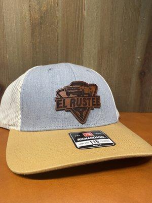 Custom laser engrave and cut cowhide leather patch on a trucker hat