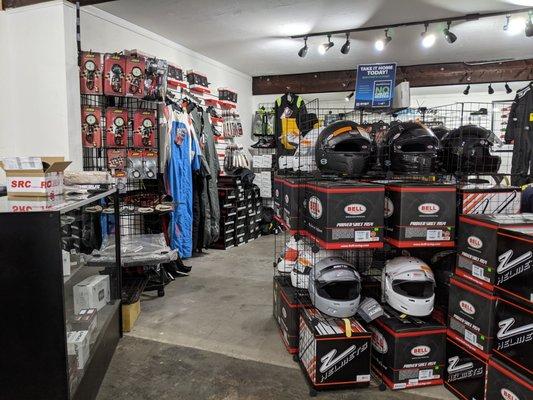 Racing helmets, fire safety gear, aftermarket performance parts, and trackside necessities.