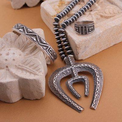 A gorgeous collection of handmade sandcast jewelry by Native American artists.