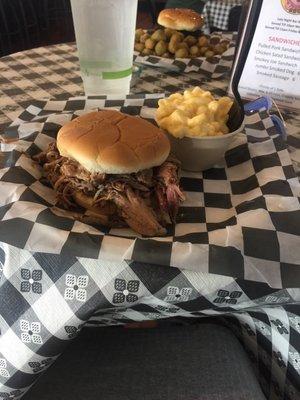 Pulled pork sandwich with a side of mac and cheese