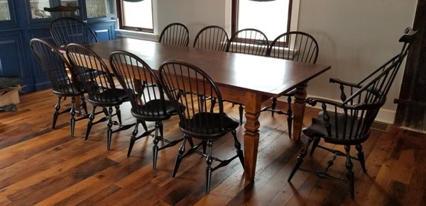 Reclaimed Fir top farm table with custom legs and a set of beautiful Windsor chairs.