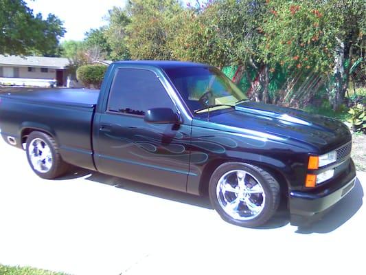 1990 Chevy 1/2 ton. Eggshell pearl green metallic. Shiny black pearl flames....work done by Krazy Kolors.