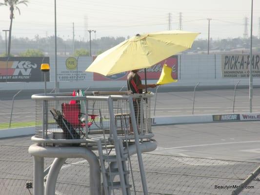 A lookout with LA Racing waves a flag at Irwindale Speedway