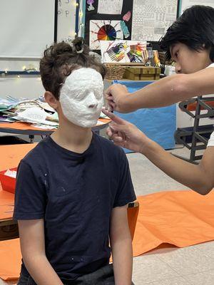 8th grade Identity boxes begin with a mask made in art.