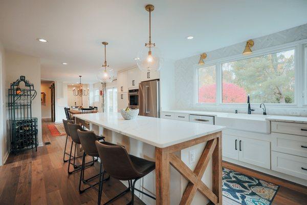 Farmhouse style kitchen remodel in Great Falls, VA with a signature kitchen island