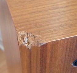 Dented-in corners from the '94 earthquake!  Also note light finish that they stained to match other pair of speakers.