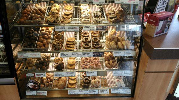 A nice doughnut, cookie and pastry selection.