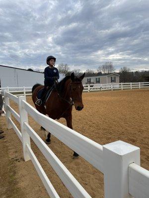 My daughter Savannah having her riding lesson in the outside arena... she loves this place.