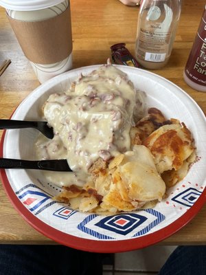 Cream chipped beef on toast and home fries.