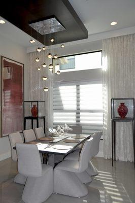 White Zebra Shades by Hunter Douglas with Sheer Panels on the sides.