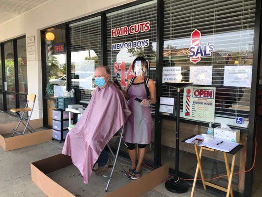 Cutting hair outdoors