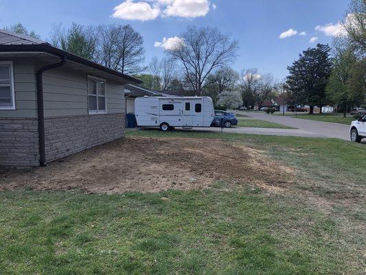 Yard was allowing water seepage in basement. We added soil to divert water away from house.