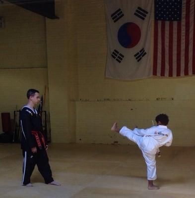 Warming up before my son's yellow belt exam