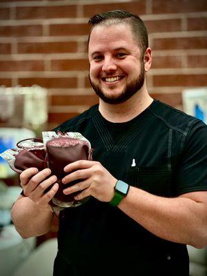 Andrew is happy to have a couple of bags of "B -" blood, but he and his colleagues Kim & Jimmy are happy to see us.