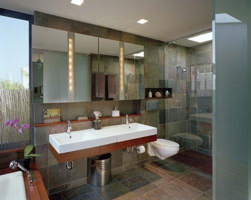 Master bath with sensual materials, lots of natural daylight,  walk in shower and soaking tub with a view.