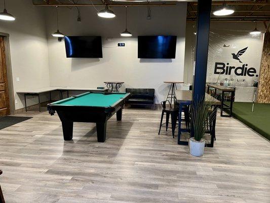 Additional "hang out" area with pool table and seating.