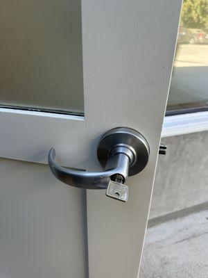 high graded rekey on a commercial door lock handle