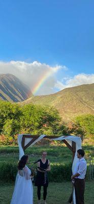 Magical backyard wedding in Olowalu as rainbow appears during the ceremony.