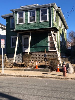 Before the new porch, siding, front doors