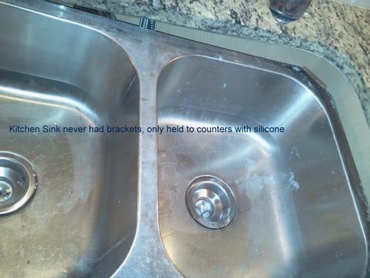 Sink didn't have any brackets...only epoxied to counter