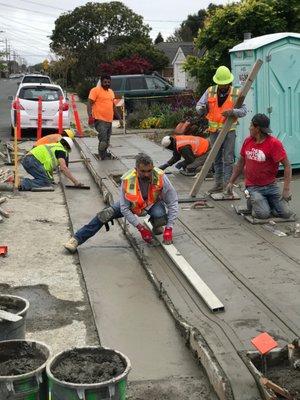 Nick Nicolau, President (center), personally putting the finishing touches to a beautiful job