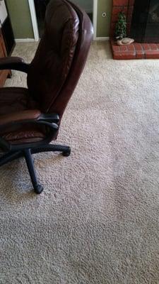 You can clearly see where we had a carpet protector under the chair. This is not a high traffic area. Doesn't look cleaned.