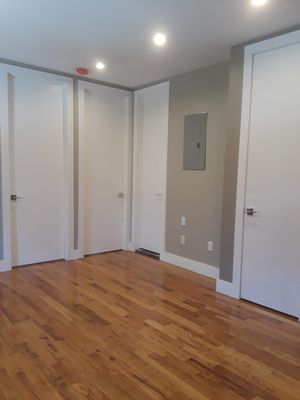 Moldings installation, skim coat , paint , door installed , floors polished & kitchen cabinet installed in Astoria Queens.