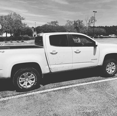 Putting on 4 tires in Target parking lot after customer blow tire