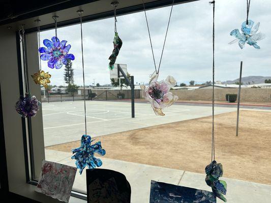 Hans Christensen Middle School students create art out of recycled bottles