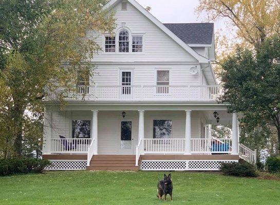 After all wood trim around windows and porch were painted (added vinyl siding)