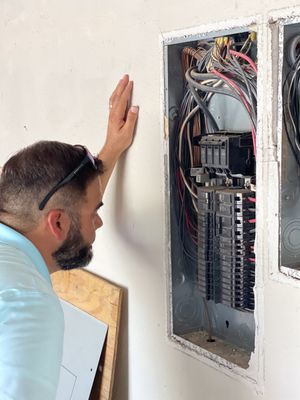 Our home inspectors remove electrical covers to check for issues with the wiring and breakers.